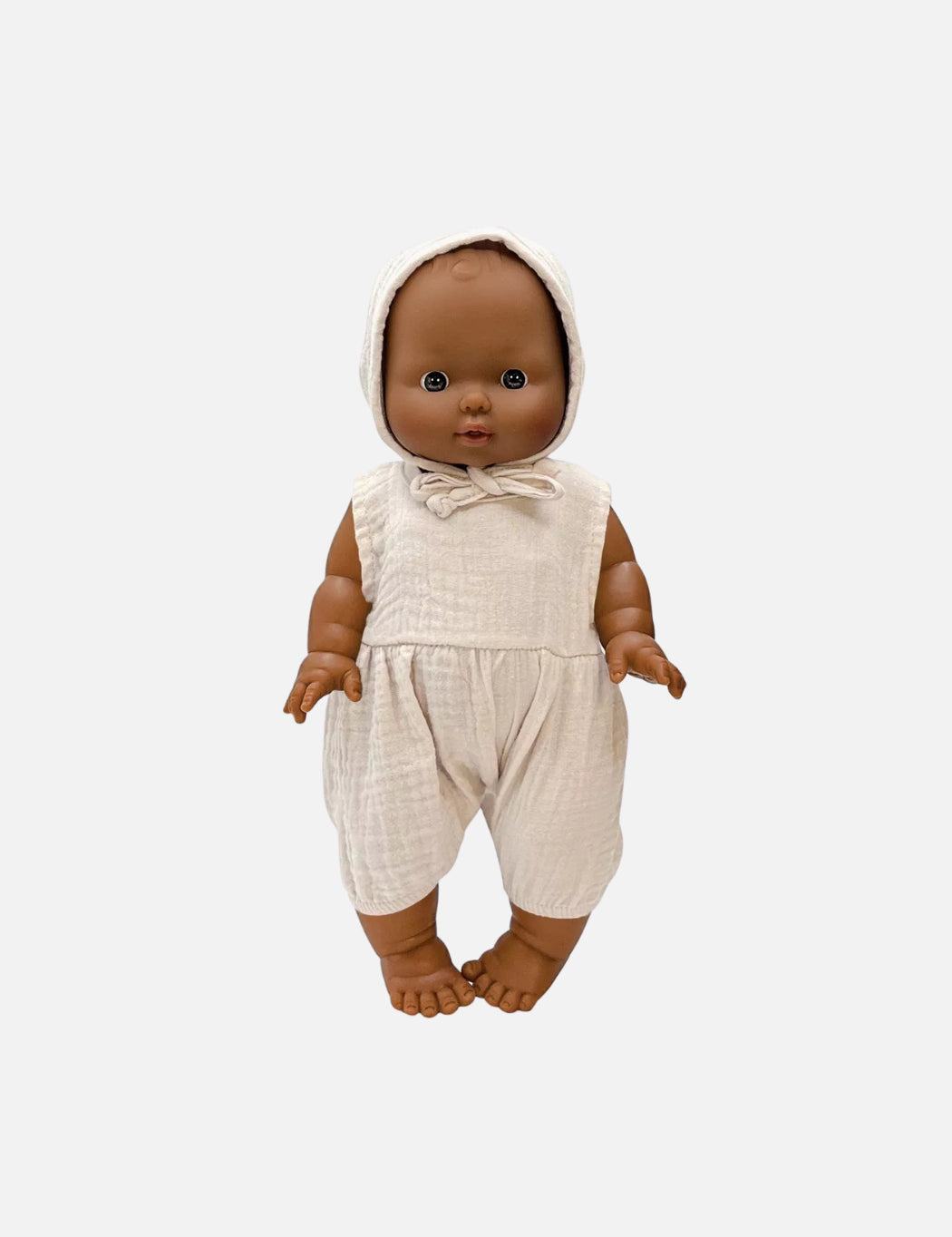 Baby doll wearing a beige outfit on a white background